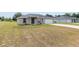A cozy single-story home featuring a well-maintained lawn and driveway at 6561 Sw 129Th Loop, Ocala, FL 34473