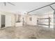 Spacious garage with garage door, water heater, shelving, and interior access at 6561 Sw 129Th Loop, Ocala, FL 34473