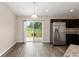 Open kitchen featuring stainless steel appliances, dark cabinetry, and sliding glass doors to the backyard at 6561 Sw 129Th Loop, Ocala, FL 34473