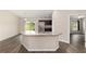 Open kitchen with modern stainless steel appliances and island with sink at 6561 Sw 129Th Loop, Ocala, FL 34473