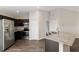 Bright kitchen with granite countertops, stainless steel appliances, and an island with seating at 6561 Sw 129Th Loop, Ocala, FL 34473