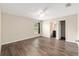 Spacious main bedroom with wood-look flooring, a window, and an ensuite bathroom at 6561 Sw 129Th Loop, Ocala, FL 34473