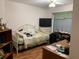 Functional bedroom with a work space, with bright lighting and ample space for organization at 7251 Sw 115Th Pl, Ocala, FL 34476