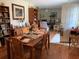 Dining room showcasing a wooden table, chairs, and ample natural light, creating a cozy atmosphere at 7251 Sw 115Th Pl, Ocala, FL 34476