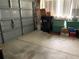 Functional garage space, with garage door, and ample storage for tools and equipment at 7251 Sw 115Th Pl, Ocala, FL 34476
