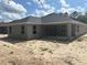 Spacious backyard with a covered patio, perfect for outdoor entertaining and relaxing at 7637 Sw 180Th Cir, Dunnellon, FL 34432