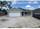 Charming single-story home with a two-car garage and well-manicured lawn at 7637 Sw 180Th Cir, Dunnellon, FL 34432