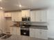 Contemporary kitchen design with ample cabinet space and a sleek, modern aesthetic at 7637 Sw 180Th Cir, Dunnellon, FL 34432