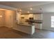 Modern kitchen featuring an island, stainless steel appliances, and white cabinetry at 7637 Sw 180Th Cir, Dunnellon, FL 34432