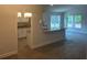 Open-concept living area featuring hardwood floors and lots of natural light at 7637 Sw 180Th Cir, Dunnellon, FL 34432