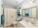 Bright bathroom with a shower-tub combo, decorative towels, and vanity at 8420 Sw 93 Ln # E, Ocala, FL 34476