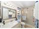 Bathroom featuring a glass-enclosed shower and a large mirror above the sink at 8420 Sw 93 Ln # E, Ocala, FL 34476