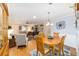 Combined dining and living spaces with hardwood floors and a cohesive design at 8420 Sw 93 Ln # E, Ocala, FL 34476