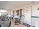 Cozy front porch seating area with decorative details offering a welcoming entrance to the home at 8420 Sw 93 Ln # E, Ocala, FL 34476