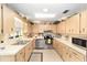 Bright kitchen featuring stainless steel appliances and abundant counter space at 8420 Sw 93 Ln # E, Ocala, FL 34476