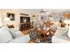 Spacious living room with hardwood floors, a fireplace, and ample seating at 8420 Sw 93 Ln # E, Ocala, FL 34476
