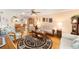 Comfortable living room featuring hardwood floors, a ceiling fan, and an open layout at 8420 Sw 93 Ln # E, Ocala, FL 34476