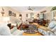 Bright living room with hardwood floors, a fireplace, and comfortable furnishings at 8420 Sw 93 Ln # E, Ocala, FL 34476