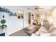 Bright sunroom with comfortable seating and views into another room at 8420 Sw 93 Ln # E, Ocala, FL 34476