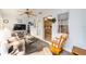 Inviting sunroom with a TV and French doors to a view of the kitchen at 8420 Sw 93 Ln # E, Ocala, FL 34476