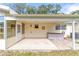 Covered patio with a spa, offering a perfect outdoor retreat space at 8420 Sw 93 Ln # E, Ocala, FL 34476