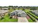 Aerial view of single-Gathering home with well-manicured landscaping and a three-car garage at 8772 Se 130Th Loop, Summerfield, FL 34491
