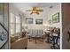 Cozy living room showcasing plantation shutters, tasteful decor, and comfortable seating at 8772 Se 130Th Loop, Summerfield, FL 34491