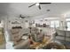 Spacious living room with a large layout, and an open-concept design that leads into the kitchen at 8772 Se 130Th Loop, Summerfield, FL 34491