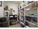 Spacious pantry with ample shelving and storage for food, appliances, and other household items at 8772 Se 130Th Loop, Summerfield, FL 34491