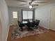 Cozy dining area with a black table and a door to the backyard at 8801 Sw 92Nd St # B, Ocala, FL 34481