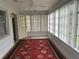 Sunroom with many windows and a tile floor at 8801 Sw 92Nd St # B, Ocala, FL 34481
