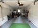 Spacious garage with ample storage, a sink, and a green patch on the floor at 8801 Sw 92Nd St # B, Ocala, FL 34481
