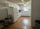 Efficient kitchen with white cabinetry and a dining area at 8801 Sw 92Nd St # B, Ocala, FL 34481