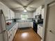 Functional kitchen with white cabinets and modern appliances at 8801 Sw 92Nd St # B, Ocala, FL 34481