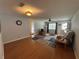 Open-concept living room with hardwood floors and neutral walls at 8801 Sw 92Nd St # B, Ocala, FL 34481