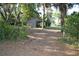 Rustic barn nestled among mature trees on a rural property at 1050 E Highway 329, Citra, FL 32113