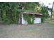 Charming, overgrown barn on a lush, grassy lot at 1050 E Highway 329, Citra, FL 32113