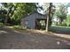 Metal outbuilding perfect for workshop space, and set within a tranquil treed landscape at 1050 E Highway 329, Citra, FL 32113