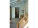 Room needing repairs with a view of stacked lumber and boxes at 1050 E Highway 329, Citra, FL 32113