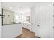Bright bathroom showcasing a glass-enclosed shower and double vanity with white cabinets at 10562 Sw 96Th Lane Rd, Ocala, FL 34481