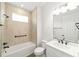 Bright bathroom featuring a shower and bathtub combination with modern fixtures at 10562 Sw 96Th Lane Rd, Ocala, FL 34481