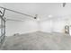 A spacious two-car garage with a garage door and ample room for storage at 10562 Sw 96Th Lane Rd, Ocala, FL 34481