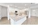 Well-lit kitchen featuring white cabinets, granite countertops, and stainless steel appliances at 10562 Sw 96Th Lane Rd, Ocala, FL 34481