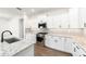 Close up of a modern kitchen with stainless steel appliances and white cabinets at 10562 Sw 96Th Lane Rd, Ocala, FL 34481