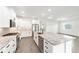 Modern kitchen featuring white cabinets, stainless steel appliances, and a granite island at 10562 Sw 96Th Lane Rd, Ocala, FL 34481