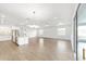 Open concept living area with tile floors, modern lighting, and a view to the lanai at 10562 Sw 96Th Lane Rd, Ocala, FL 34481