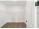 Walk-in pantry featuring adjustable white wire shelving for optimal storage space at 10562 Sw 96Th Lane Rd, Ocala, FL 34481