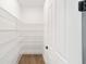 Walk-in pantry featuring adjustable white wire shelving for optimal storage at 10562 Sw 96Th Lane Rd, Ocala, FL 34481