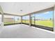 Covered outdoor patio with screen windows allowing for neighborhood views at 10562 Sw 96Th Lane Rd, Ocala, FL 34481