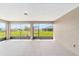 A serene enclosed outdoor patio offering neighborhood views with plenty of sunlight at 10562 Sw 96Th Lane Rd, Ocala, FL 34481
